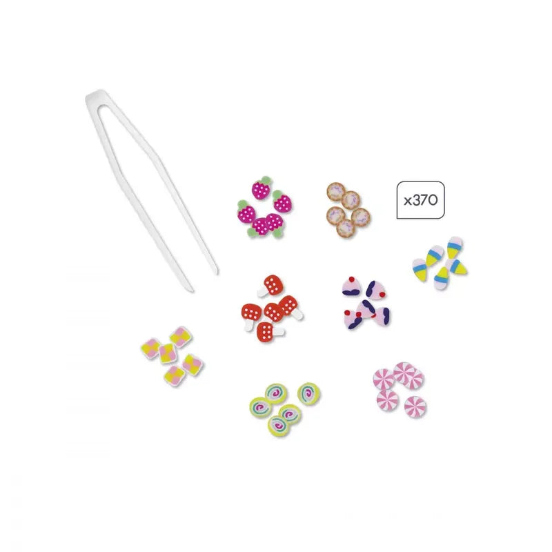 The Janod Cane Painting Sweet Treats creative kit for children aged 7 to 12 includes plastic tweezers and an assortment of colorful, patterned beads in X-shapes and round clusters. The "x370" label indicates the quantity of beads, featuring patterns like polka dots, stripes, swirls, and geometric shapes – perfect for a fun decorating activity.