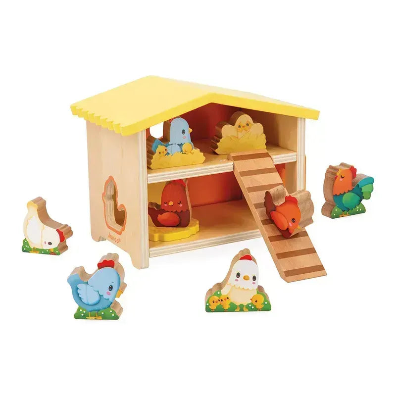 The Janod Farm - My First Chicken Coop is a wooden early learning toy with a yellow roof and a ladder that leads to an upper level. It includes several colorful wooden chicken figures, which can be placed around and inside the coop using cut-out slots designed to fit the chickens into the structure, making it an engaging educational toy for toddlers.