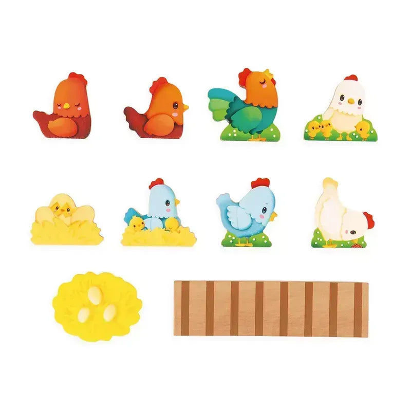 Introducing the Janod Farm - My First Chicken Coop: a charming set featuring cute, colorful hen and chick figures. The collection includes two red hens, one green rooster, one white hen with chicks, two yellow chicks with eggs, one blue and white hen, a yellow nest with eggs, and a wooden plank—a delightful toddler educational toy perfect for imaginative play.