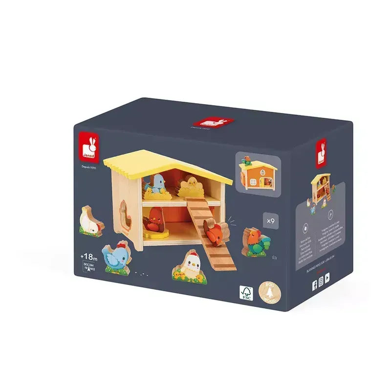 The Janod Farm - My First Chicken Coop is a toy set packaged in a box, featuring a wooden chicken coop with animal figures including chickens, hens, and chicks. This wooden educational toy encourages imaginative play. The back of the packaging showcases illustrations of the toy’s features and dimensions, while the brand logo is prominently displayed in the top left corner.