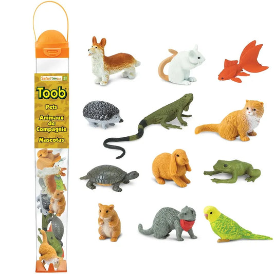 A collection of TOOB® Figurines Pets, small, detailed hand painted plastic animal figures representing various pets, including a cat, dog, rabbit, parrot, and more, displayed along with their packaging.