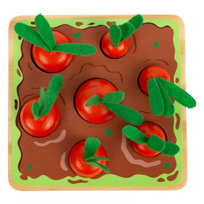 a wooden tray with Carrots Shape-Fitting Game on top of it.