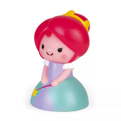 A Janod Squirter Princess & Luminous Unicorn Bath Toy sitting on top of a ball.