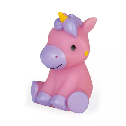 A Janod Squirter Princess & Luminous Unicorn Bath Toy sitting on top of a white floor.