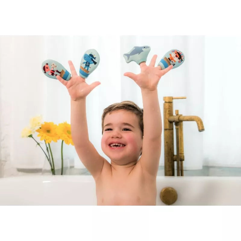 A young boy in a bathtub with The Pirates Bath Finger Puppets on his fingers and his hands in the air.