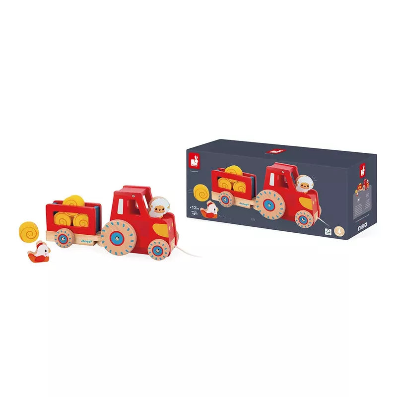 A Janod Farm Pull Along Tractor toy tractor with detachable parts and accessories, accompanied by its packaging box.