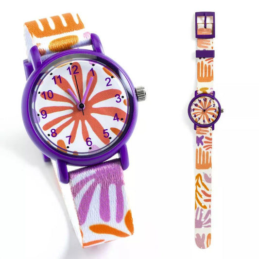 A Djeco Watch Leaves and a watch strap with a flower design.