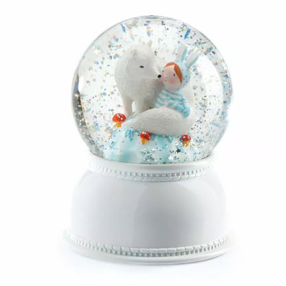 A Djeco Snow Ball Nightlight Lila & Pupi with an animal inside of it.