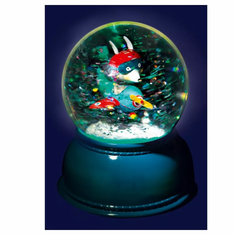 A Djeco Snow Ball Nightlight Airplane with a pokemon figure inside of it.