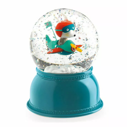 A Djeco Snow Ball Nightlight Airplane with a fish inside of it.