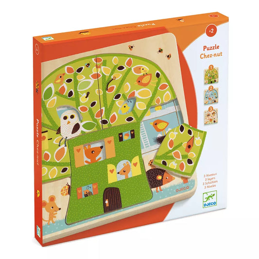 A Djeco Chez Nut 3 layers Puzzle with animals and a tree.
