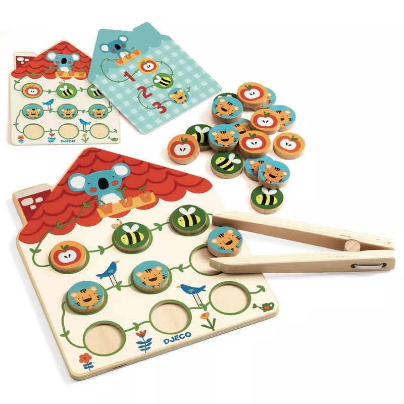A Djeco Pinstou Skill Toy with buttons and a pair of scissors.