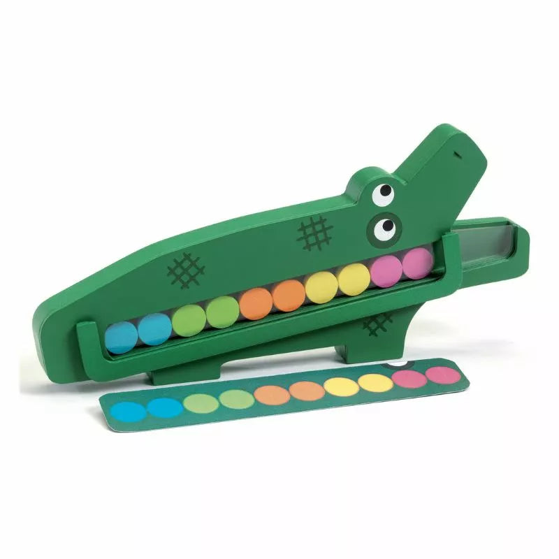 A Djeco Educational Crococroc wooden toy with a green alligator on top of it.