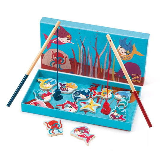 A Djeco Magnetic Fishing Game Mermaids box filled with wooden magnets and a pair of chopsticks.