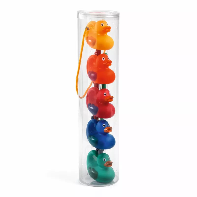 A Djeco Rainbow Fishing Ducks tube filled with colorful rubber ducks.