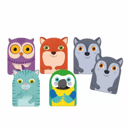 A group of Djeco Toddler Cards Game Little Family magnets sitting next to each other.