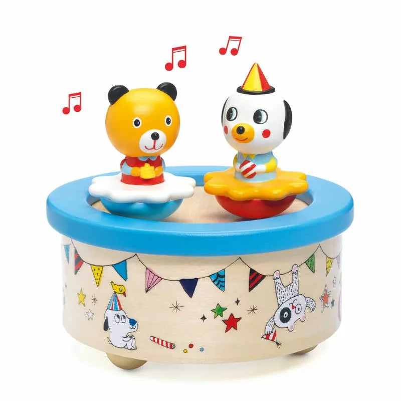Two Djeco Musical Box Fantasy Melody toy bears sitting on top of a Djeco toy pool.