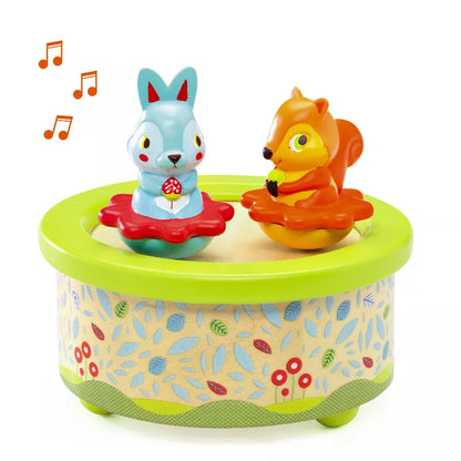 A Djeco Musical Box Friends Melody toy animal in a Djeco music box.