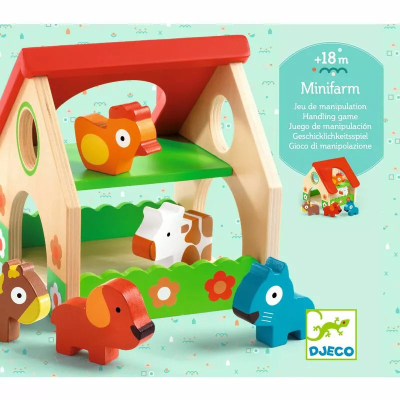 A Djeco Minifarm toy set with animals and a house.