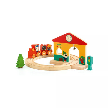 A Djeco Mini Train set with a clock on the top of it.
