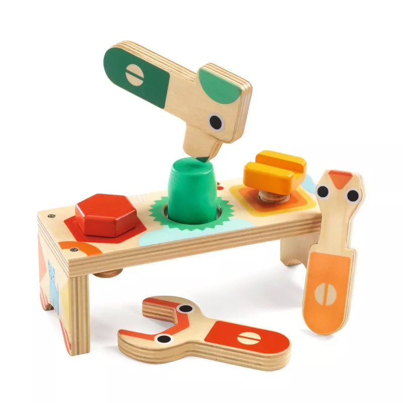 A Djeco wooden toy table with the Bricolou 1st Workbench set on top of it.