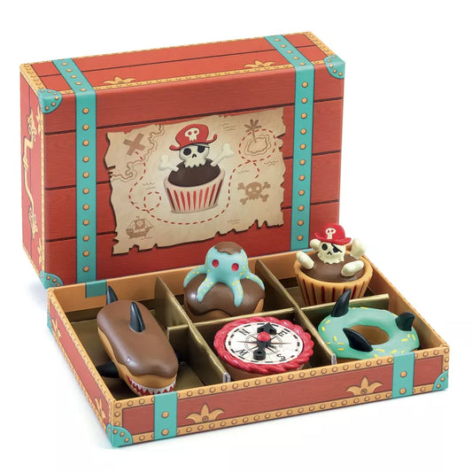 A Djeco wooden box filled with different types of Pirate Cakes.