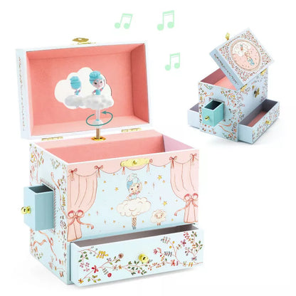 A Djeco Musical Box Ballerine on stage with a musical box inside of it.