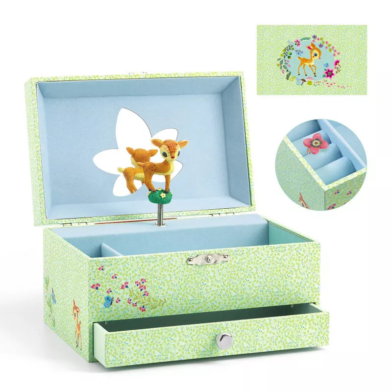 A green Djeco Musical Box The fawn's song that has a toy in it.