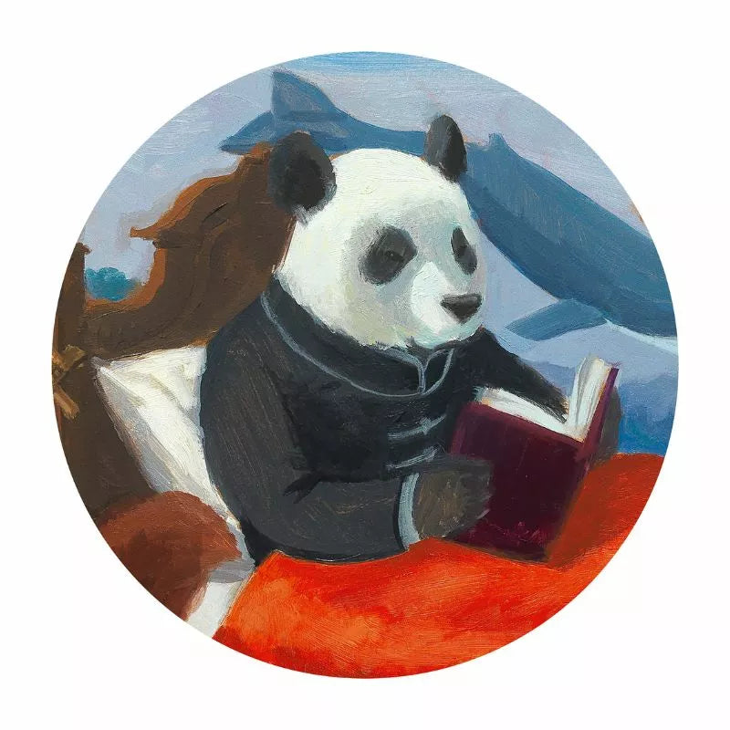 A Djeco Puzzle Summer Lake of a panda reading a book.