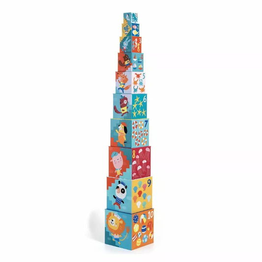 A stack of Djeco 10 Blocks Beach with cartoon characters on them.