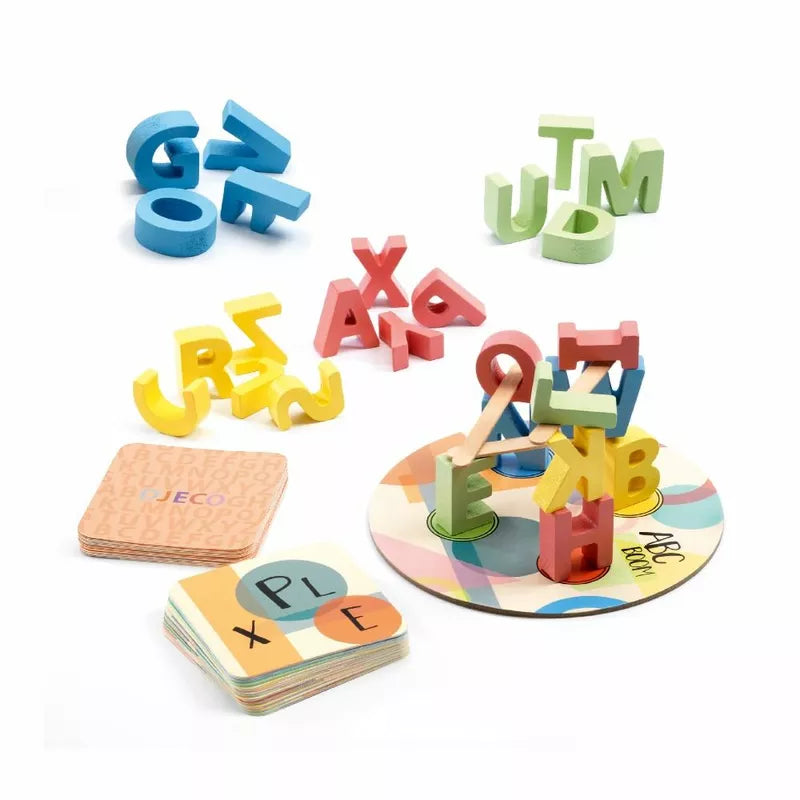 A group of letters and numbers on a plate adorned with Djeco's ABC Boom Game.