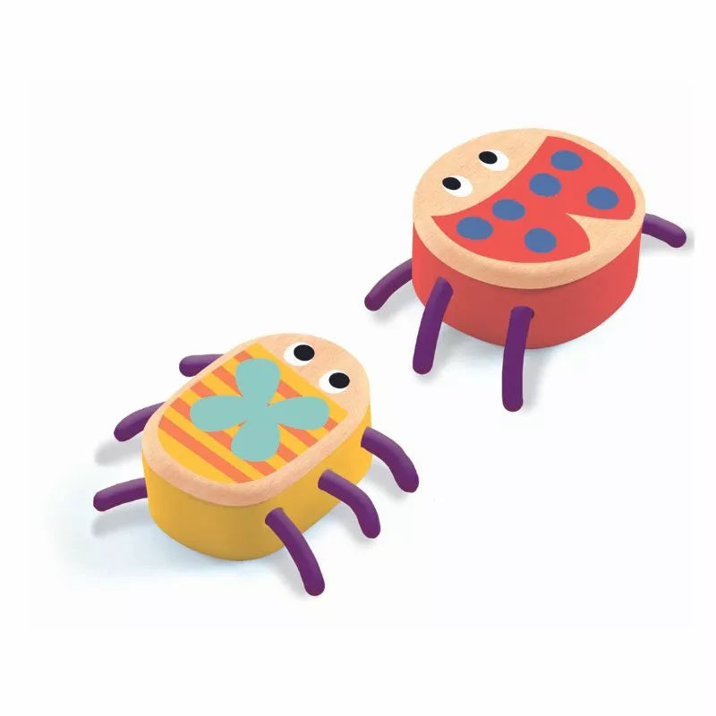 A couple of Djeco Light Clay Myplastibugs toys sitting on top of each other.