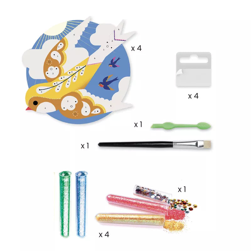 The contents of a Djeco Glitter boards – Paradisio craft kit including Djeco scissors, Djeco glue, and other items.