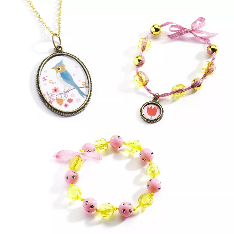 Three Djeco Beads and Flowers bracelets and a Djeco Beads and Flowers pendant on a white background.