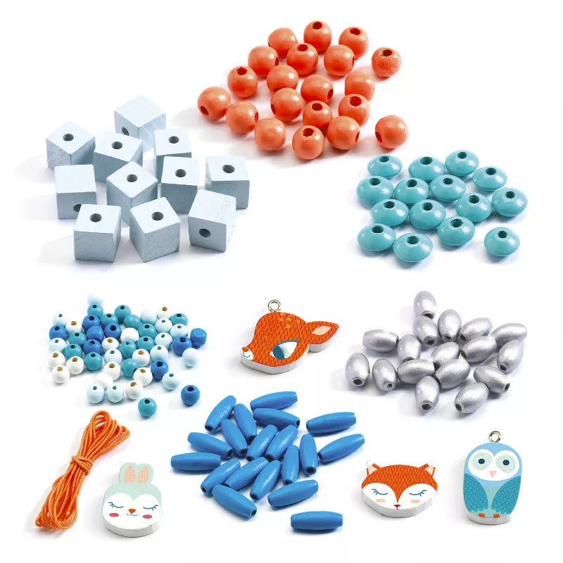 A collection of Djeco Wooden Beads, Small animals, and charms.