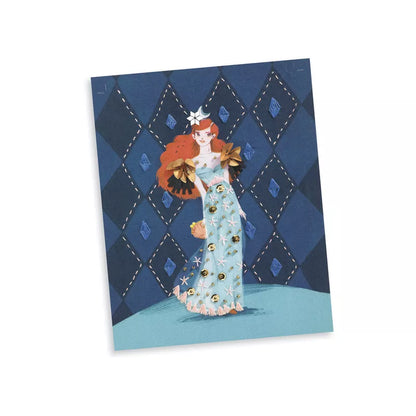 A Djeco card with a picture of a woman in a blue dress from the Djeco Embroidery – Fashion cocktail collection.