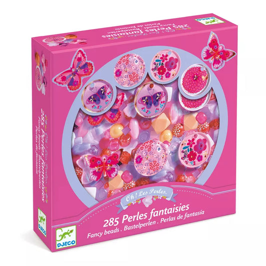 A Djeco pink box filled with lots of Djeco pink candies.