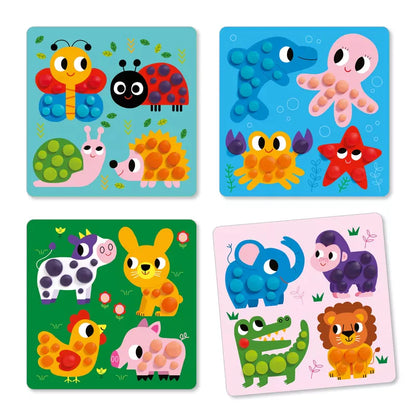 Four different animal puzzles on a white background, made by Djeco Light Clay Dough Circles.